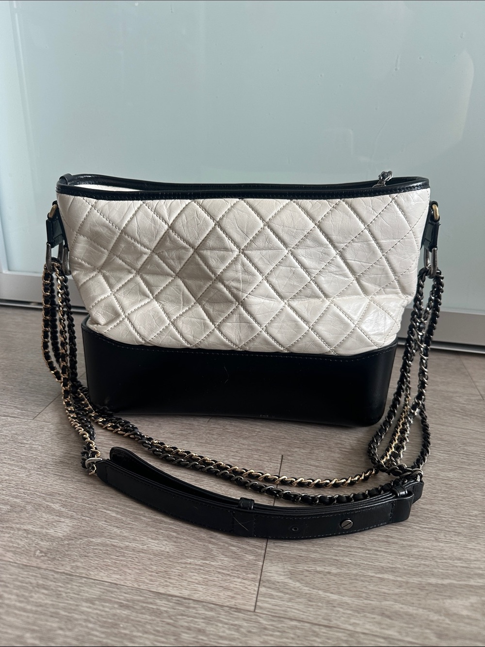Quilted Two-Tone Black and White Shoulder Bag with gradient chains. Preowned